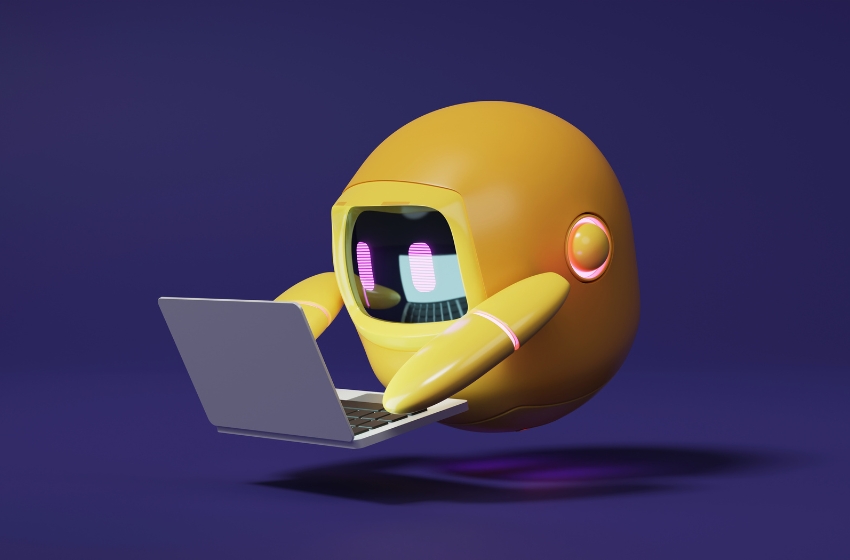 pequeno robô utilizando um notebook